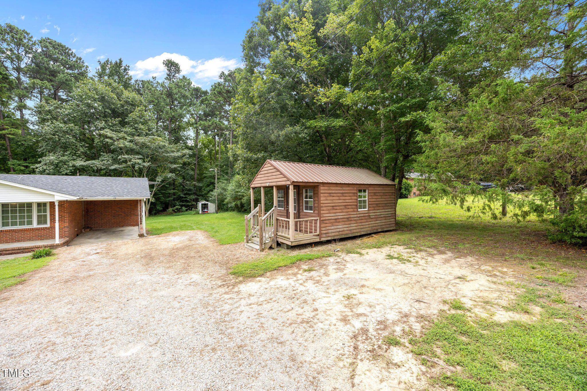 1050 Rock Spring Church Road Henderson, NC 27537 - Photo 19 of 24 a view of a house with a yard