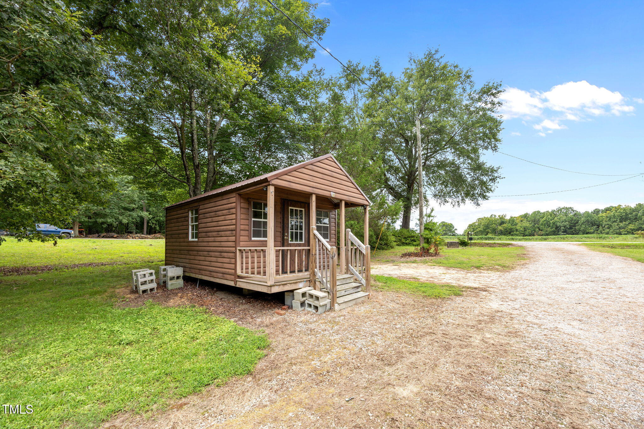 1050 Rock Spring Church Road Henderson, NC 27537 - Photo 20 of 24 a view of a house with a yard and sitting area