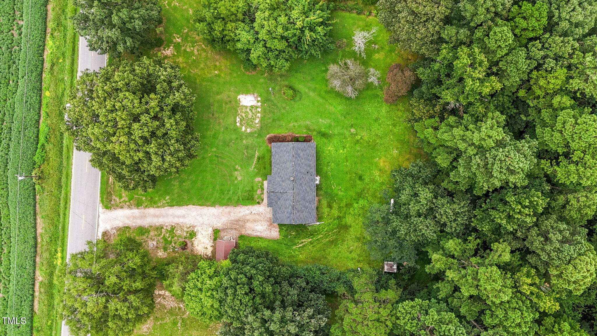 1050 Rock Spring Church Road Henderson, NC 27537 - Photo 22 of 24 a flower garden with a fountain