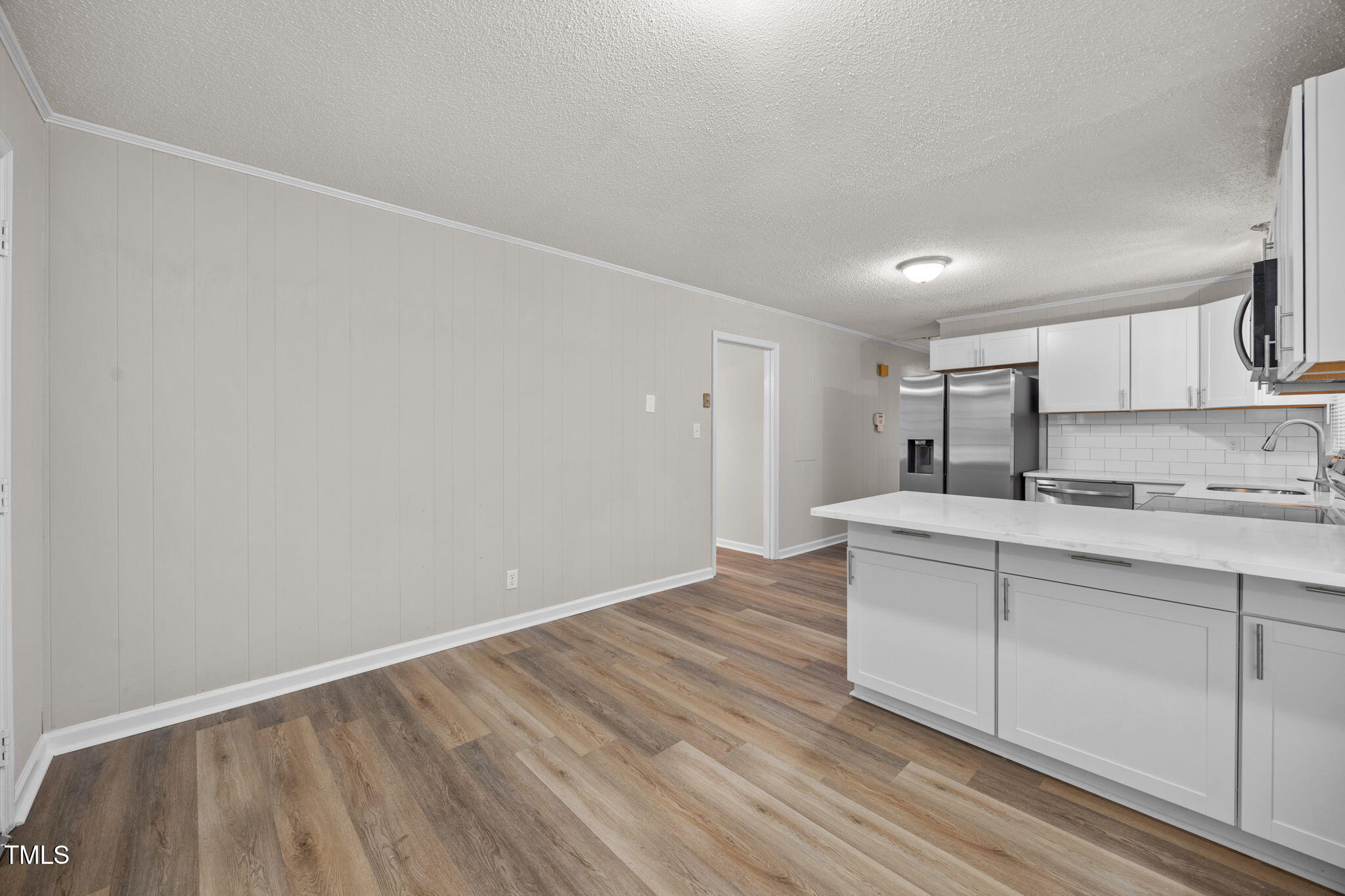 1050 Rock Spring Church Road Henderson, NC 27537 - Photo 5 of 24 a room with a sink and cabinets