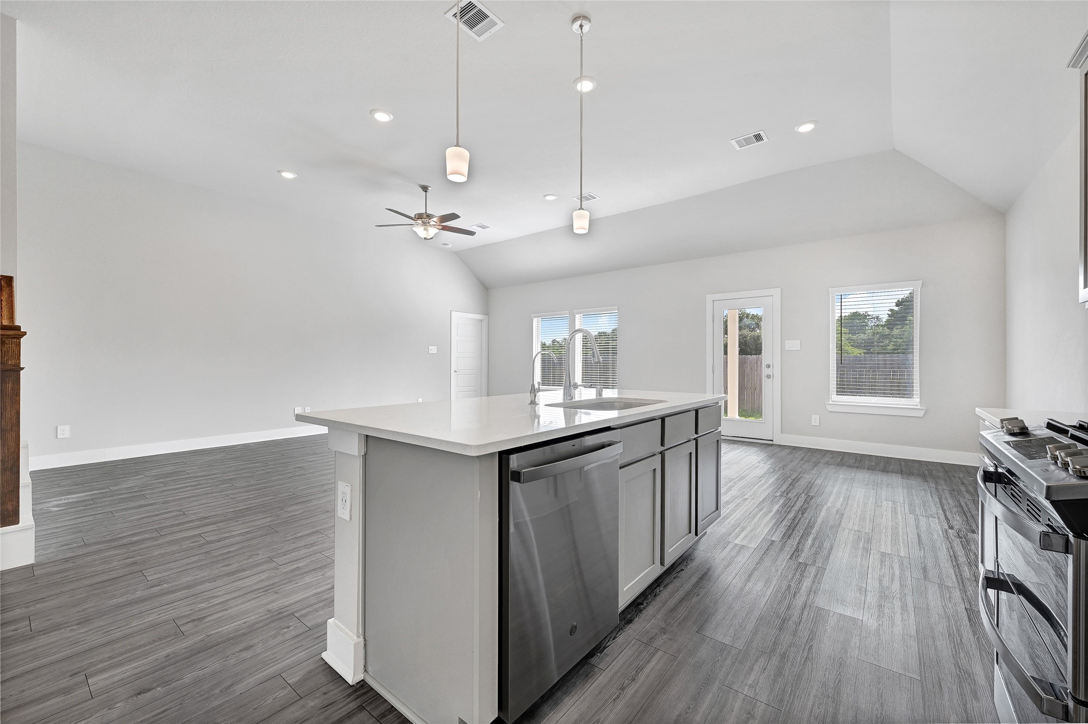 10329 South Goshawk Trail Conroe, TX 77385 - Photo 13 of 46 a view of a kitchen with a sink and wooden floor