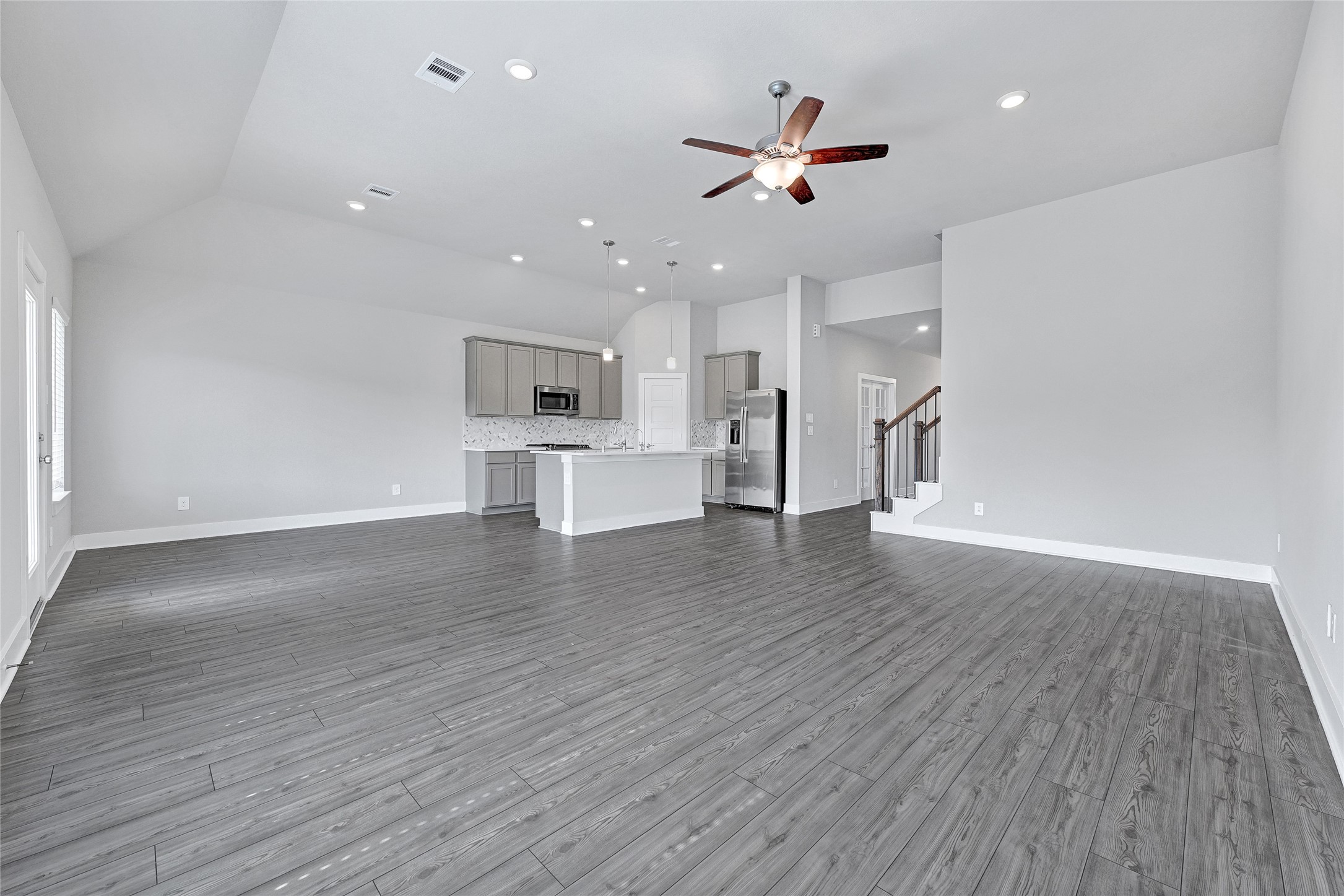 10329 South Goshawk Trail Conroe, TX 77385 - Photo 44 of 46 a view of empty room with wooden floor and ceiling fan
