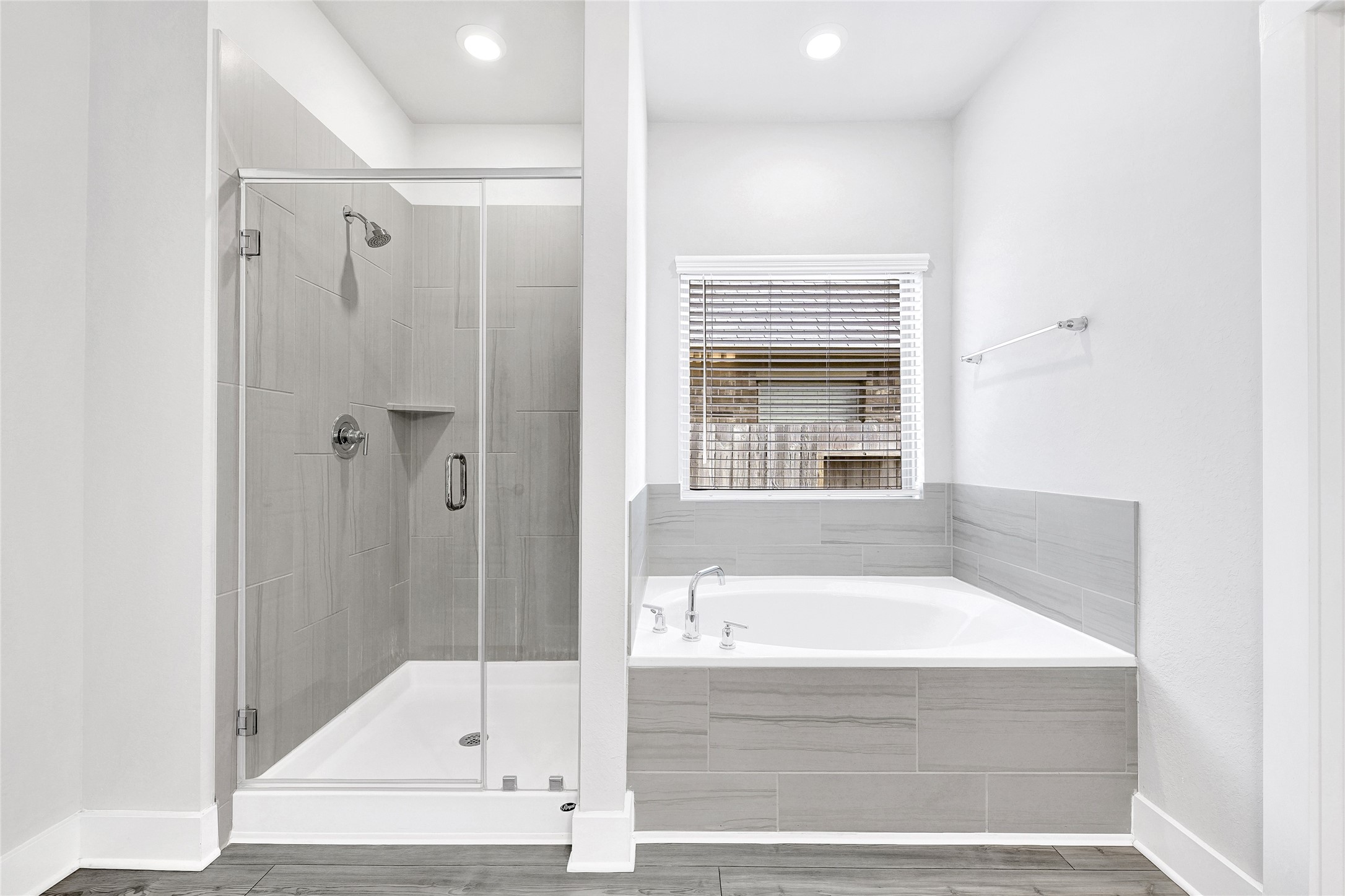 10329 South Goshawk Trail Conroe, TX 77385 - Photo 20 of 46 a bathroom with a bathtub and a shower
