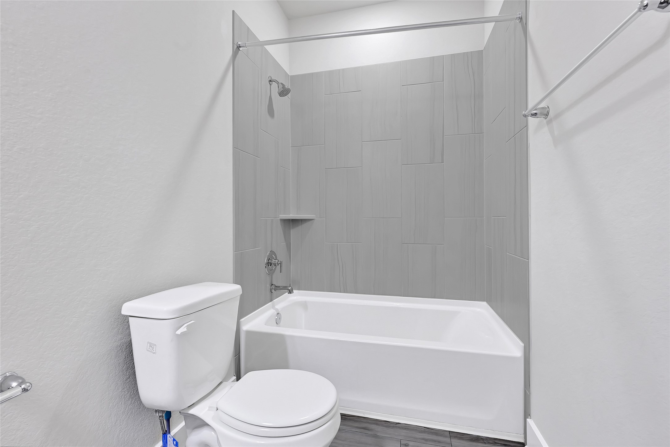 10329 South Goshawk Trail Conroe, TX 77385 - Photo 26 of 46 a white toilet and tub sitting next to a shower