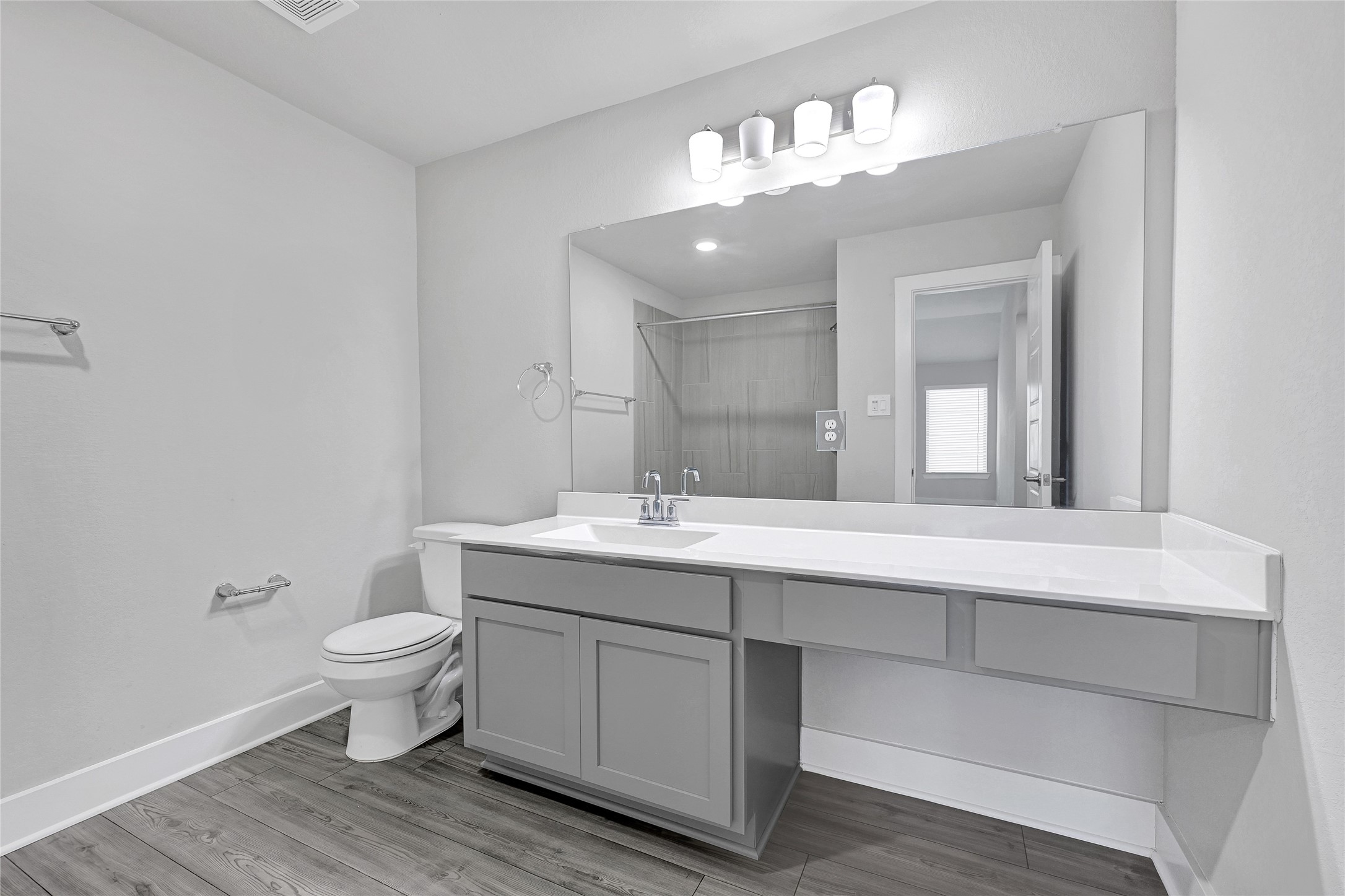 10329 South Goshawk Trail Conroe, TX 77385 - Photo 32 of 46 a bathroom with a toilet sink and mirror