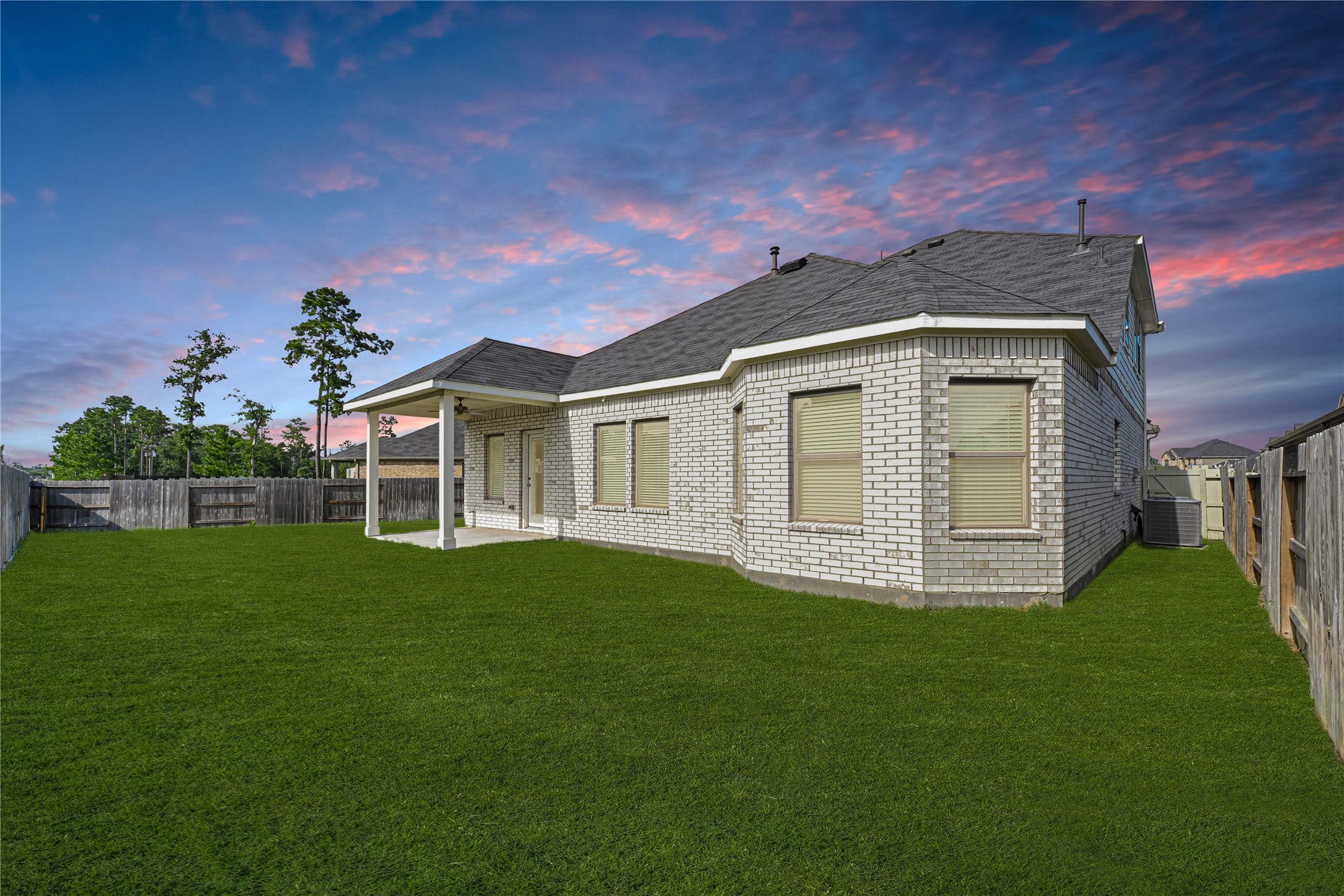 10329 South Goshawk Trail Conroe, TX 77385 - Photo 36 of 46 a front view of a house with a garden