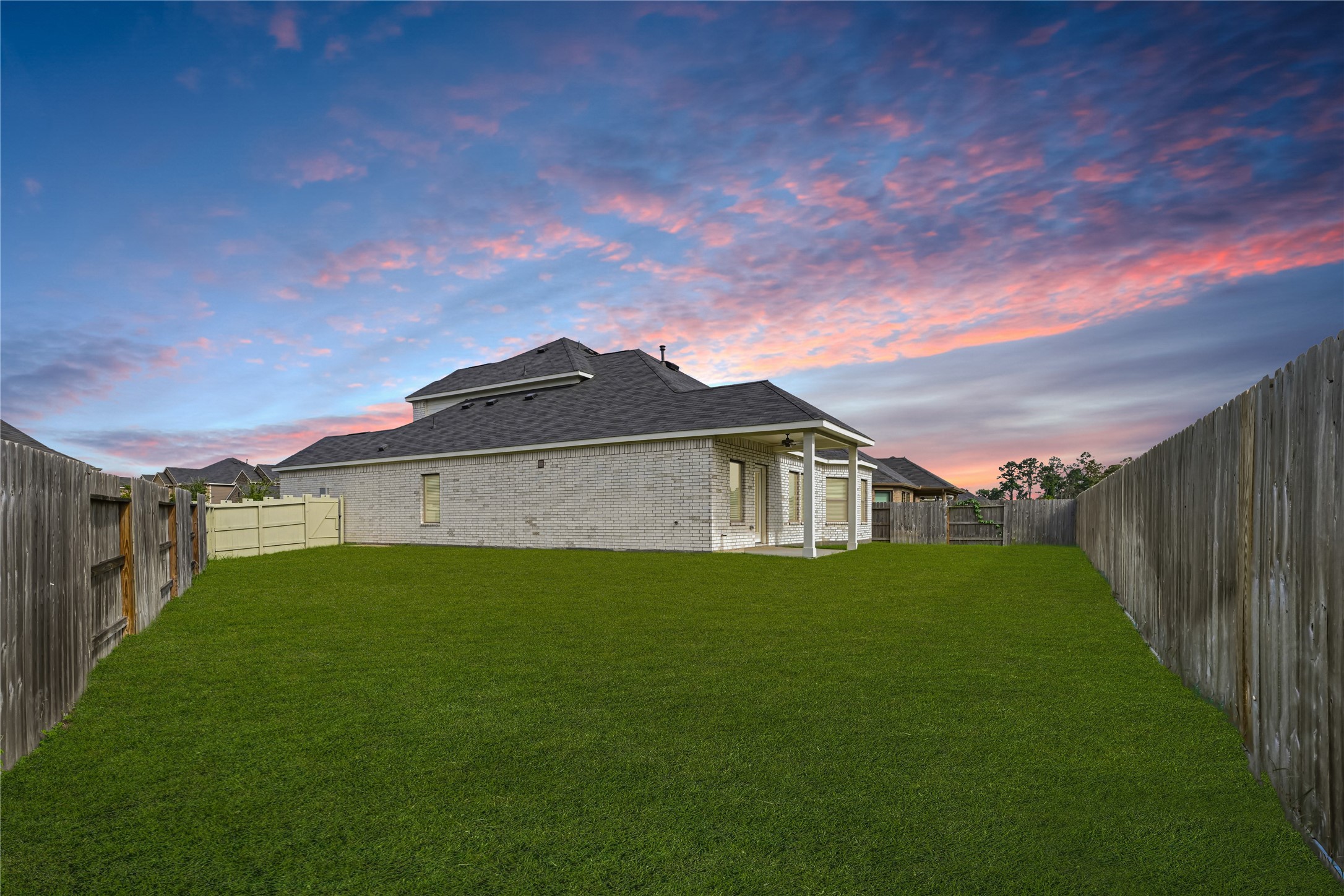 10329 South Goshawk Trail Conroe, TX 77385 - Photo 38 of 46 a view of an house with backyard