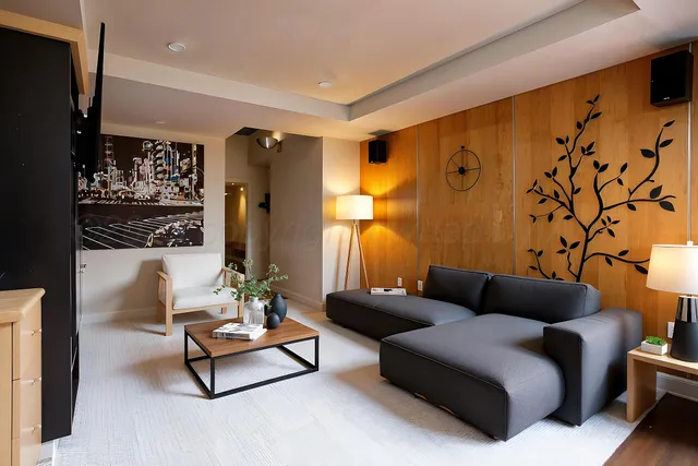 a view of an empty room with a fireplace and a window