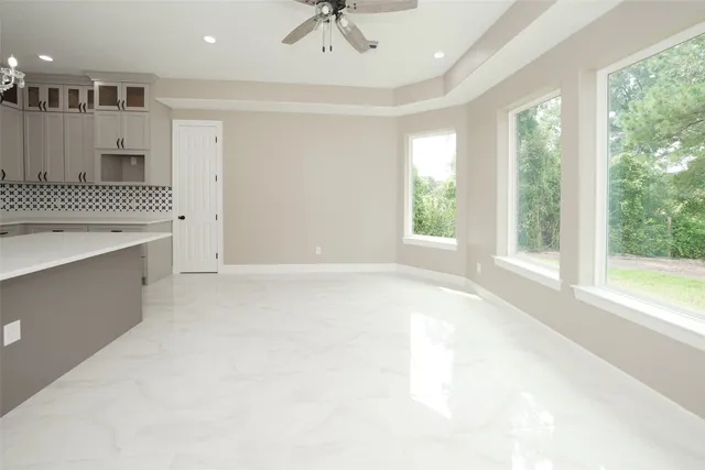 a view of a kitchen with a sink and a window