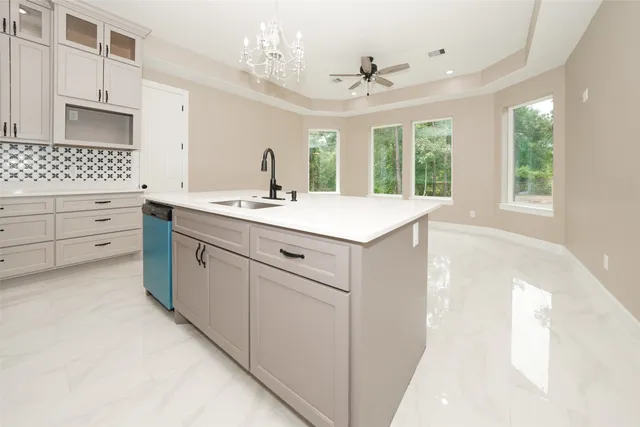 a bathroom with a sink a large mirror and a bathtub