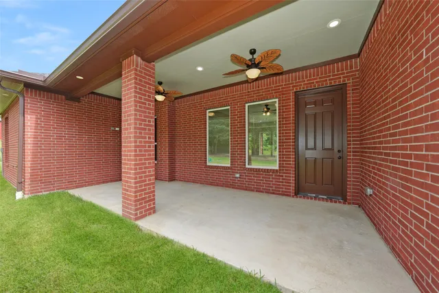 a backyard of a house with a garden and entertaining space