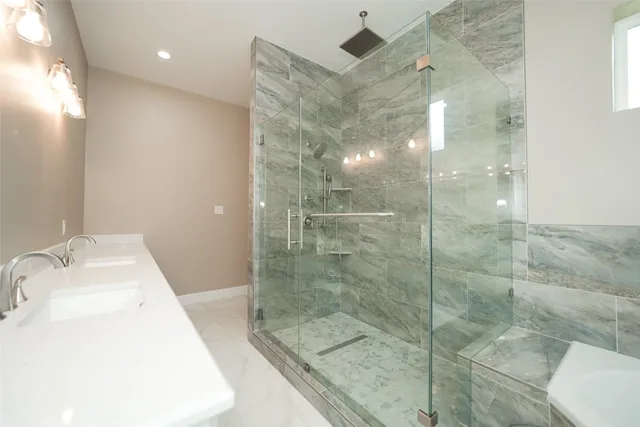 a bathroom with a shower and a sink