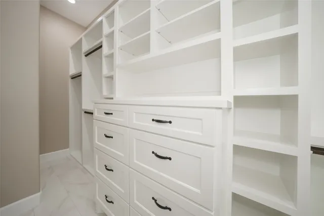 a view of an empty walk in closet