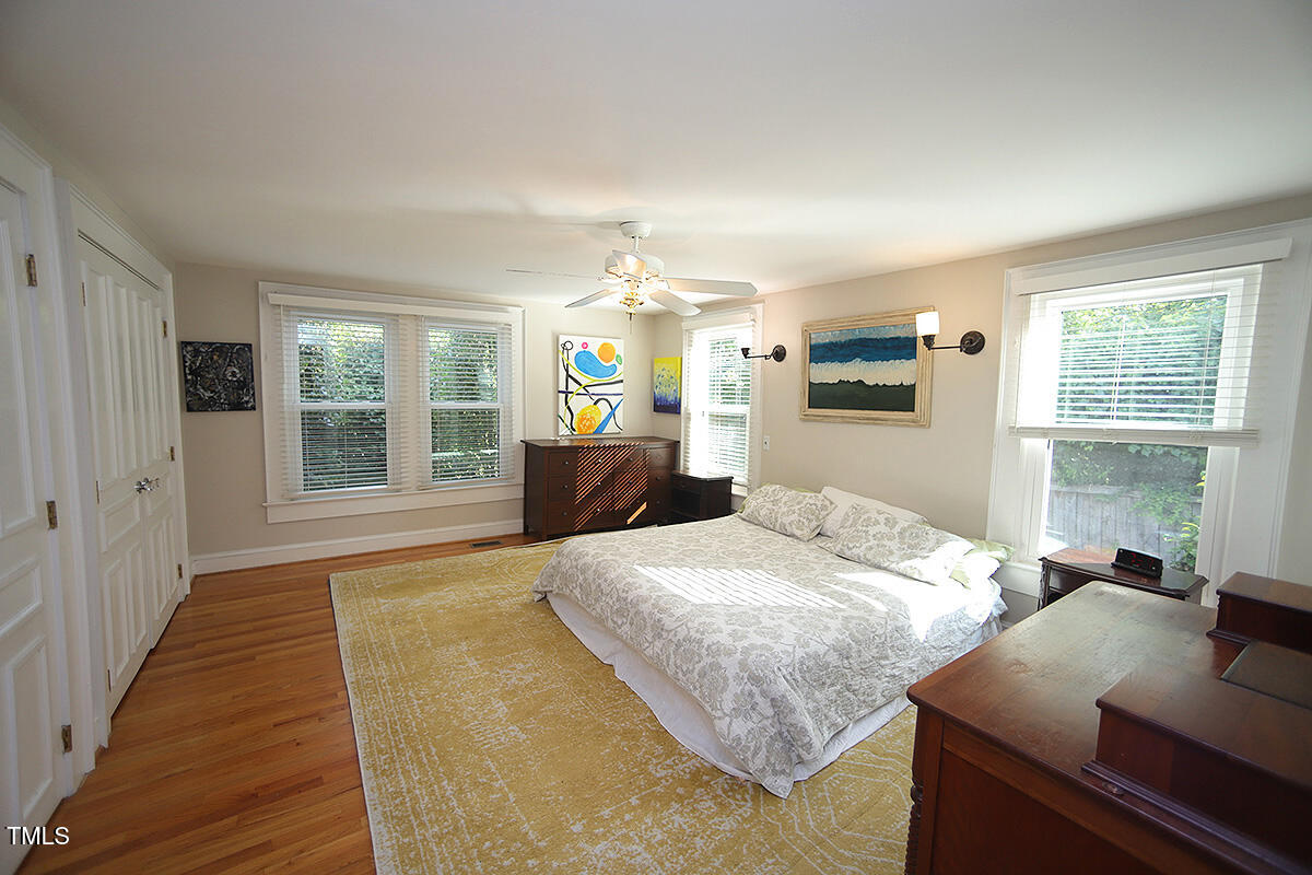 3409 White Oak Road Raleigh, NC 27609 - Photo 13 of 24 a bedroom with a bed and window