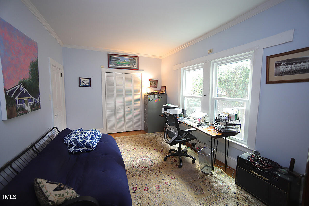 3409 White Oak Road Raleigh, NC 27609 - Photo 16 of 24 a view of a workspace with furniture and a window