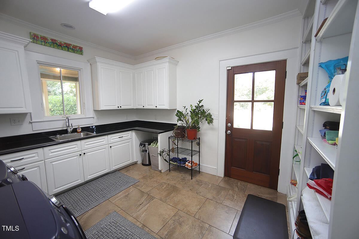 3409 White Oak Road Raleigh, NC 27609 - Photo 19 of 24 a kitchen with granite countertop a sink and a stove top oven