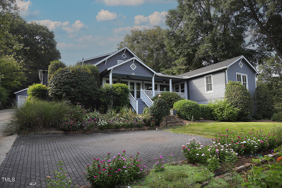 3409 White Oak Road Raleigh, NC 27609 - Photo 2 of 24 a front view of a house with a garden