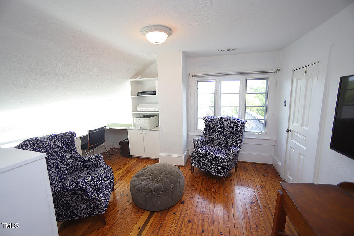 3409 White Oak Road Raleigh, NC 27609 - Photo 21 of 24 a living room with furniture and a flat screen tv
