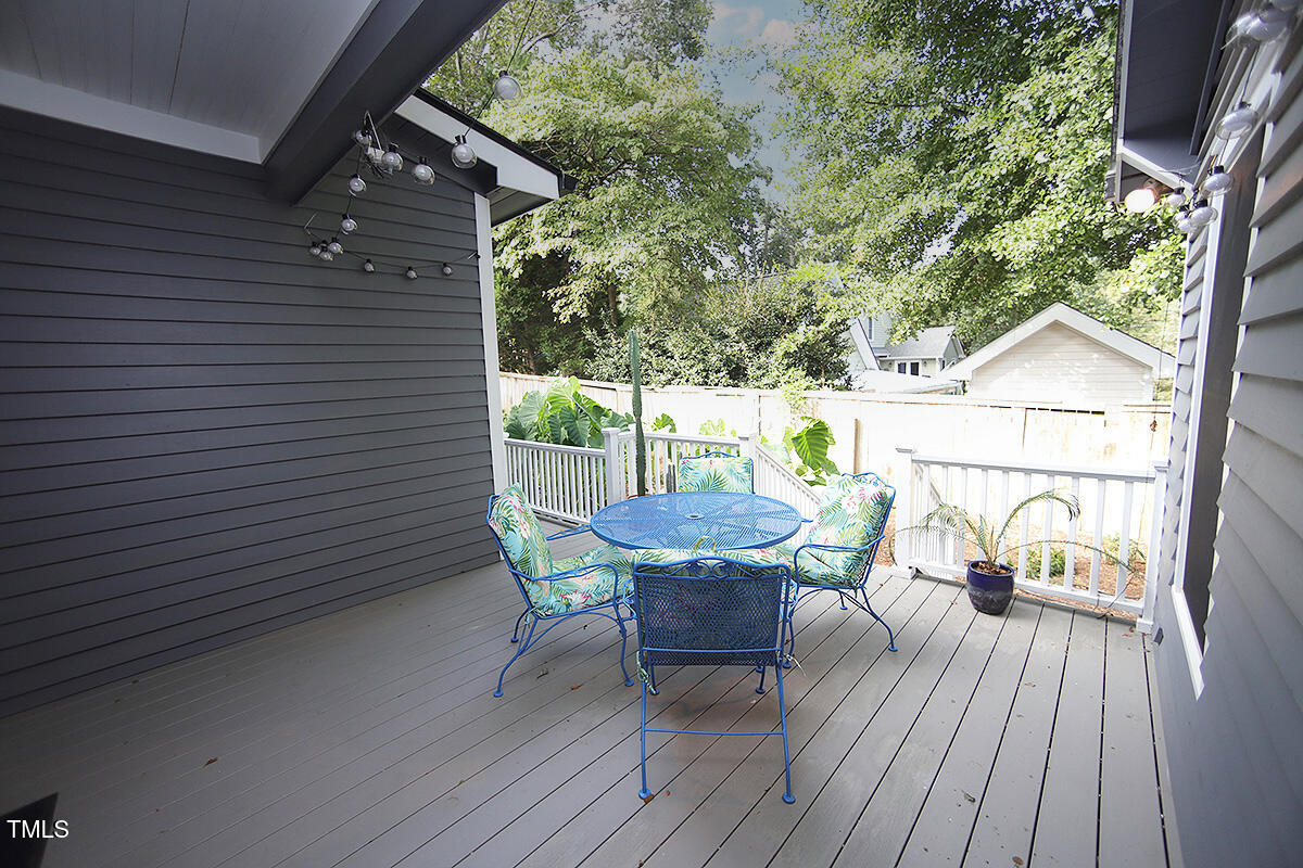 3409 White Oak Road Raleigh, NC 27609 - Photo 22 of 24 a view of a deck with furniture and a backyard