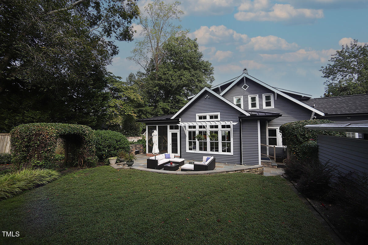 3409 White Oak Road Raleigh, NC 27609 - Photo 23 of 24 a front view of a house with a yard table and chairs