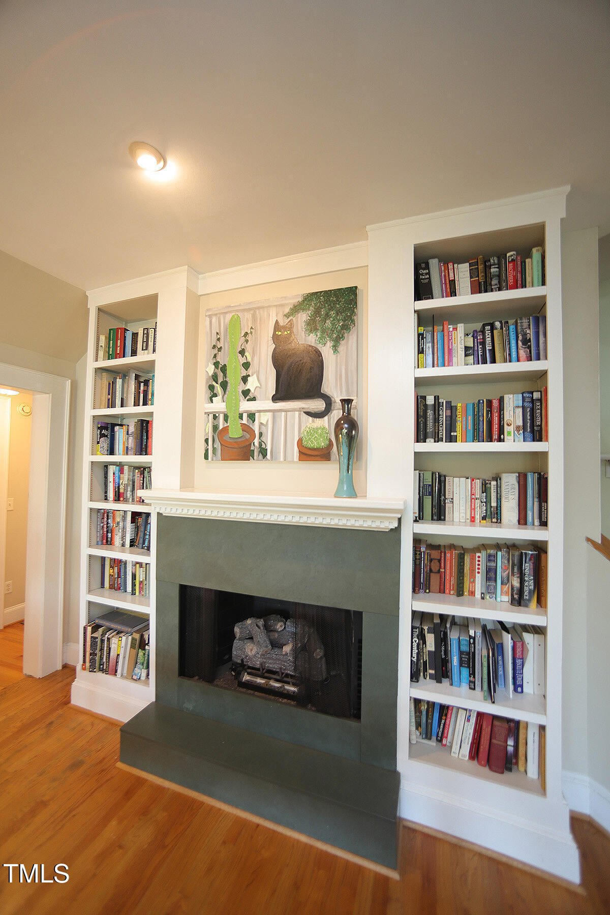 3409 White Oak Road Raleigh, NC 27609 - Photo 5 of 24 a living room with furniture and a fireplace