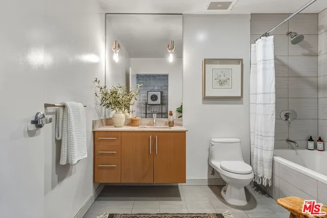 a living room with lots of furniture and a chandelier