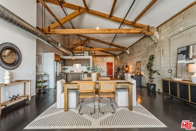 a living room with furniture and a table