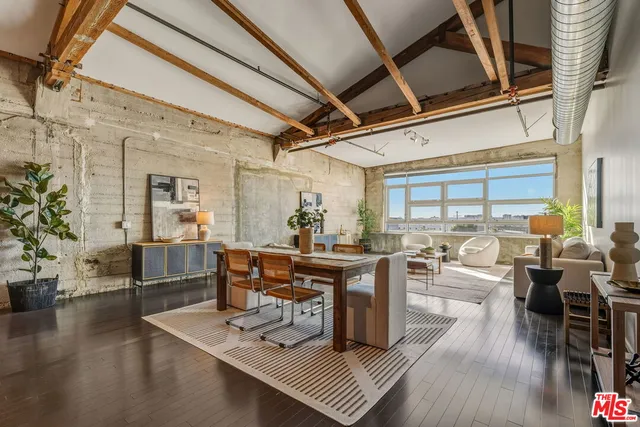 a kitchen with granite countertop a sink appliances and cabinets