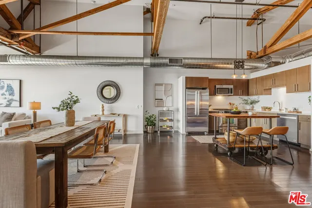 a dinning area with kitchen view dining table and chairs