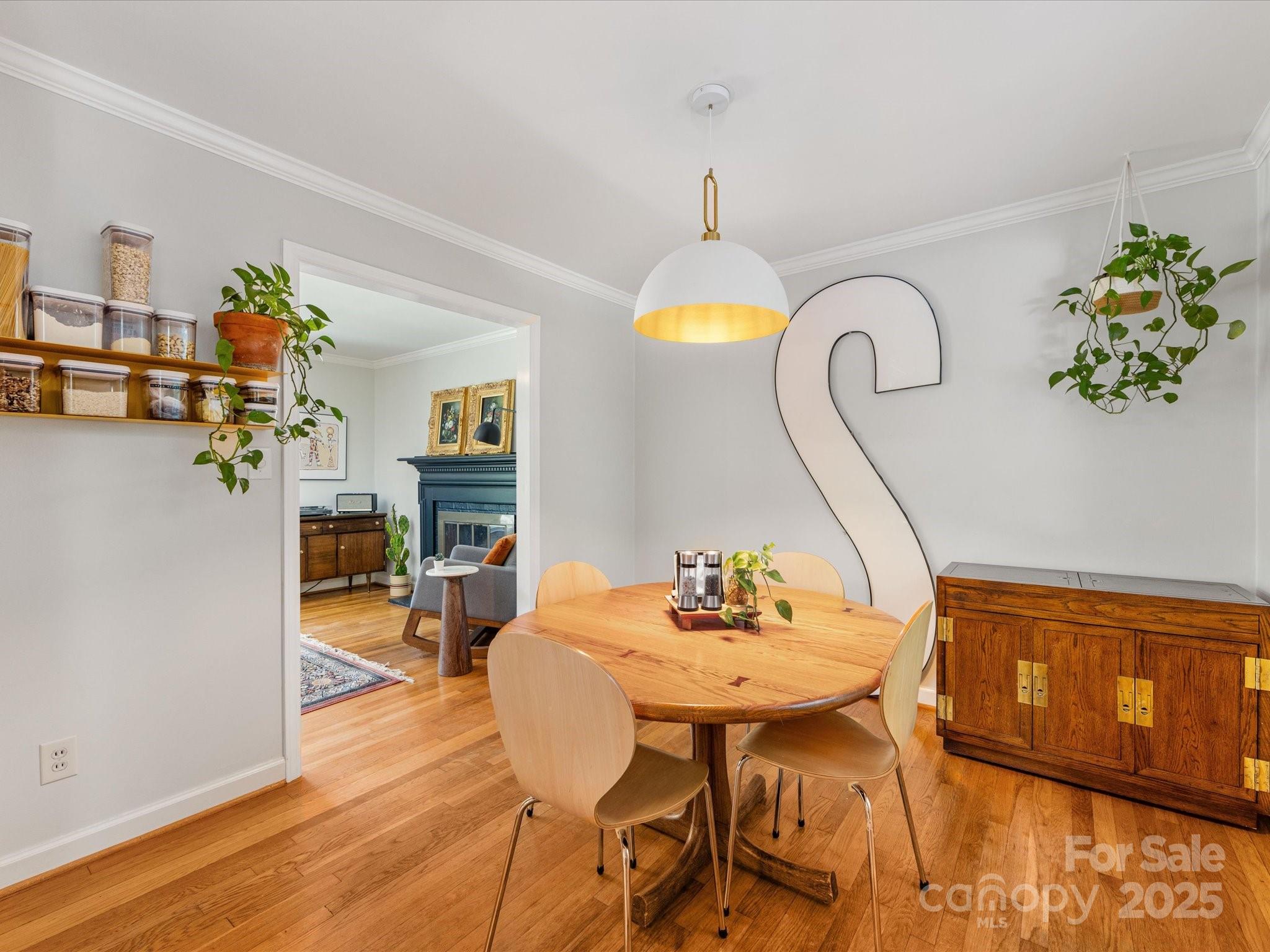 3200 Spring Valley Road Charlotte, NC 28210 - Photo 11 of 45 a view of a dining room with furniture and wooden floor