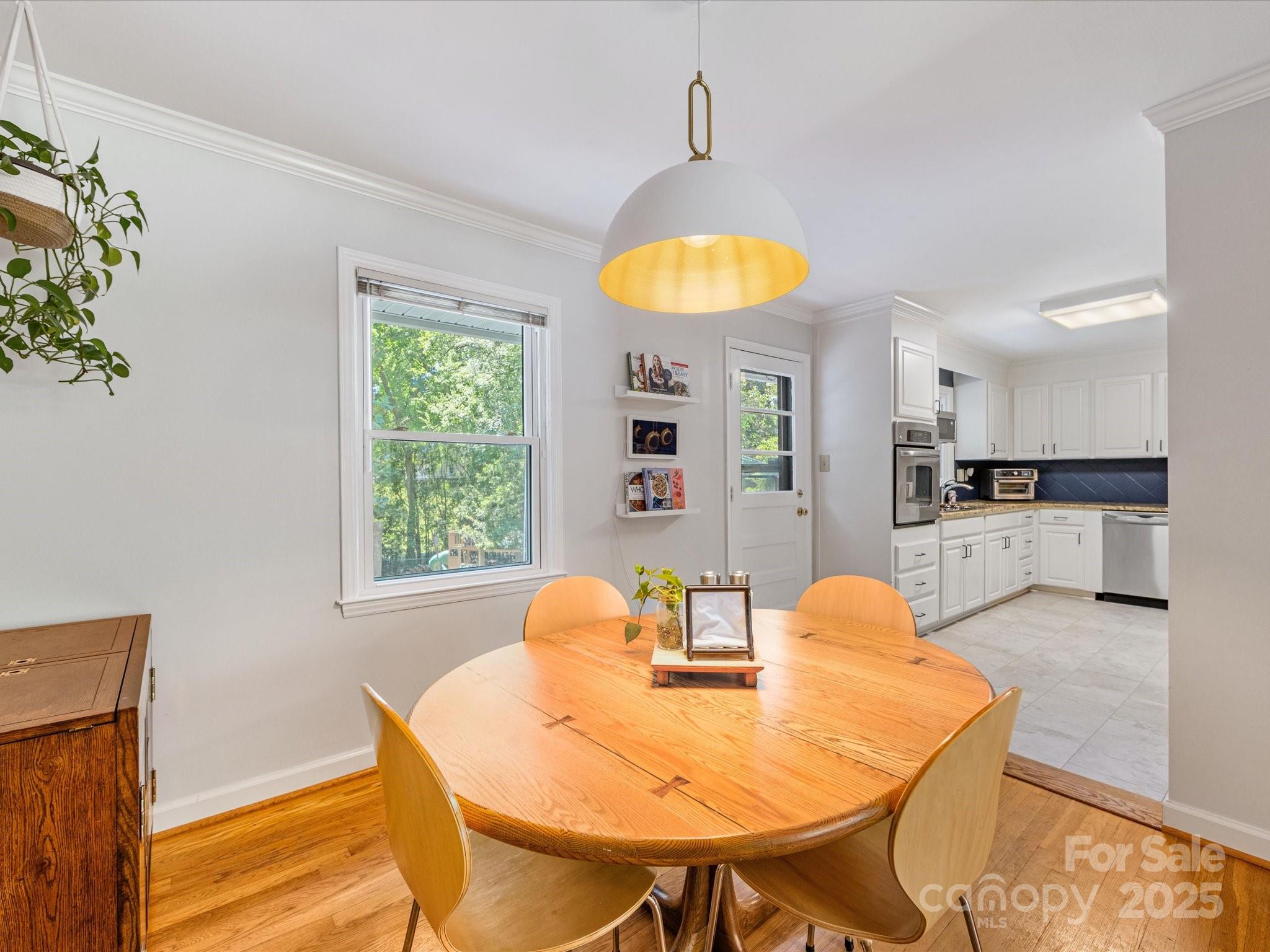3200 Spring Valley Road Charlotte, NC 28210 - Photo 13 of 45 a view of a dining room with furniture and a window