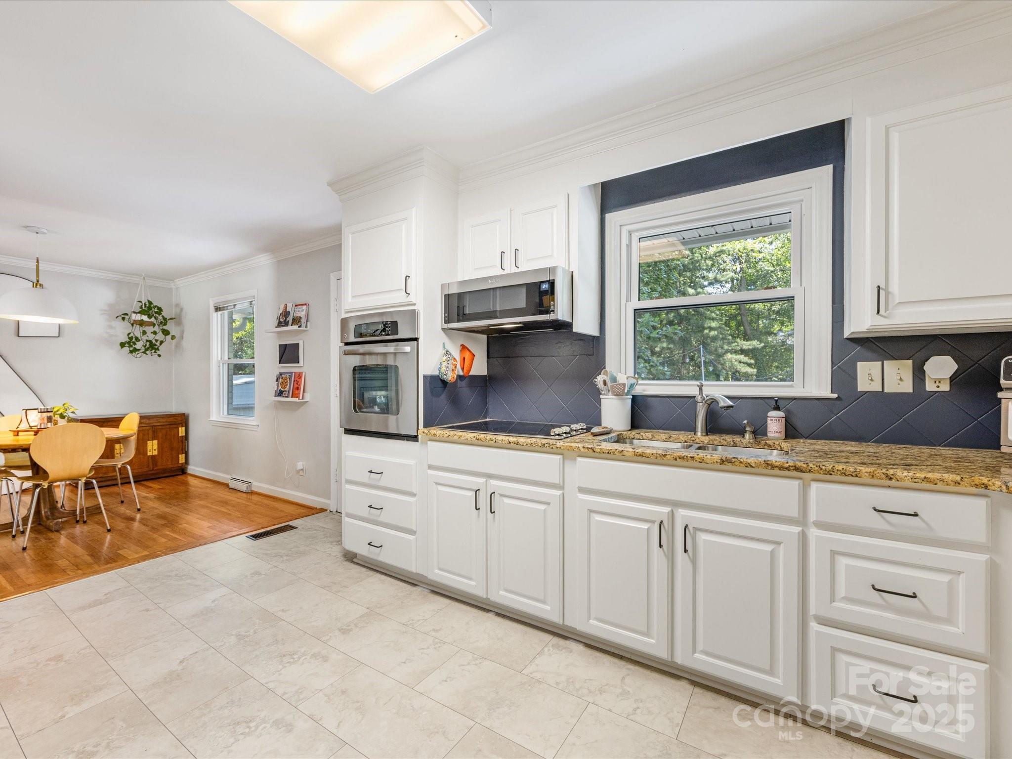 3200 Spring Valley Road Charlotte, NC 28210 - Photo 14 of 45 a kitchen with stainless steel appliances granite countertop a stove a sink and a refrigerator