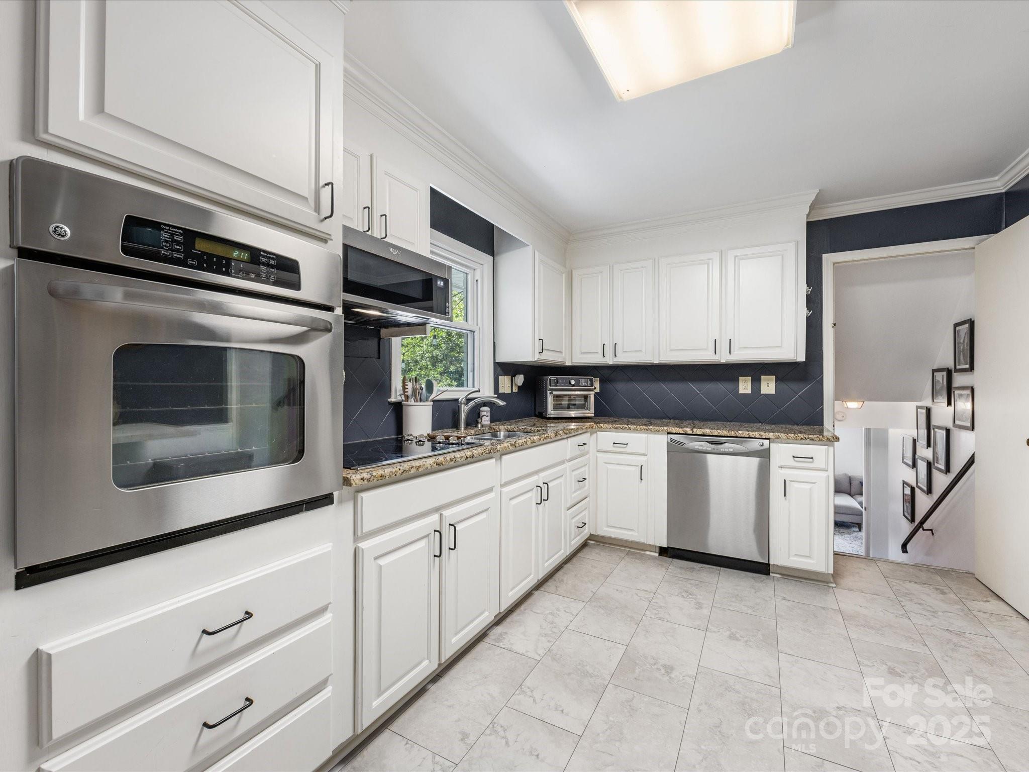 3200 Spring Valley Road Charlotte, NC 28210 - Photo 15 of 45 a kitchen with granite countertop cabinets stainless steel appliances and a counter space