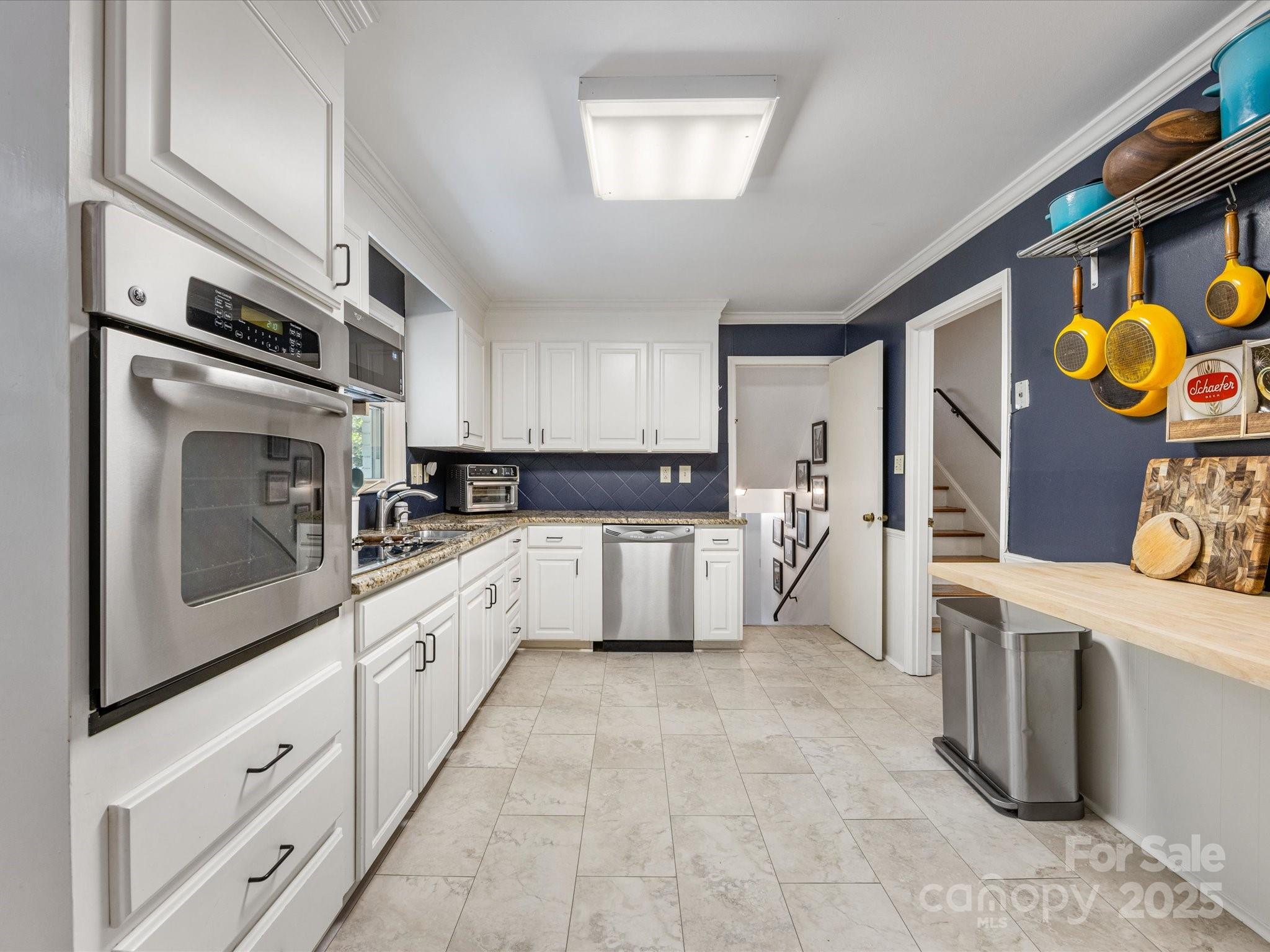 3200 Spring Valley Road Charlotte, NC 28210 - Photo 16 of 45 a kitchen with stainless steel appliances a stove a sink and a refrigerator