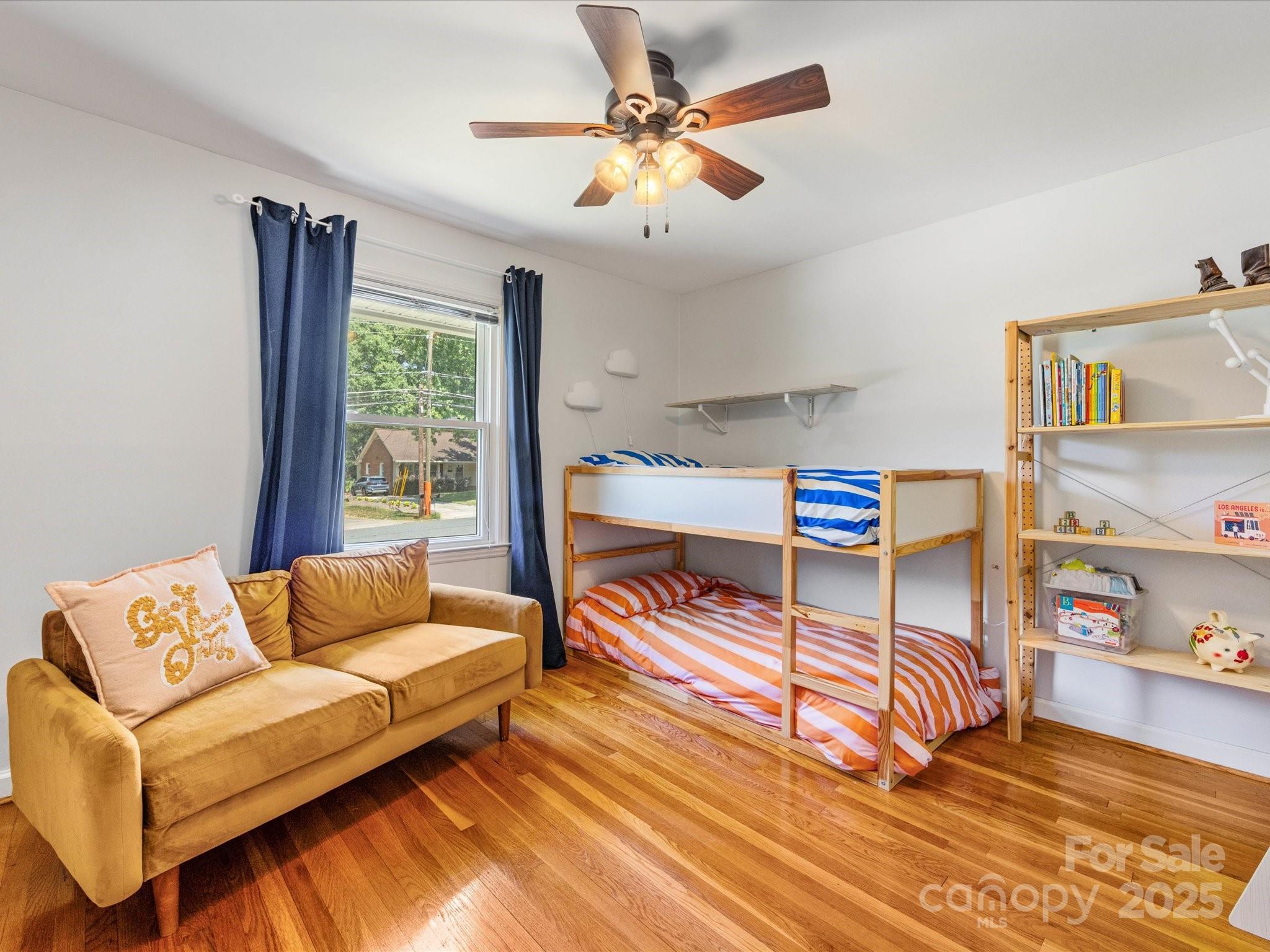 3200 Spring Valley Road Charlotte, NC 28210 - Photo 27 of 45 a bedroom with a bed and a couch