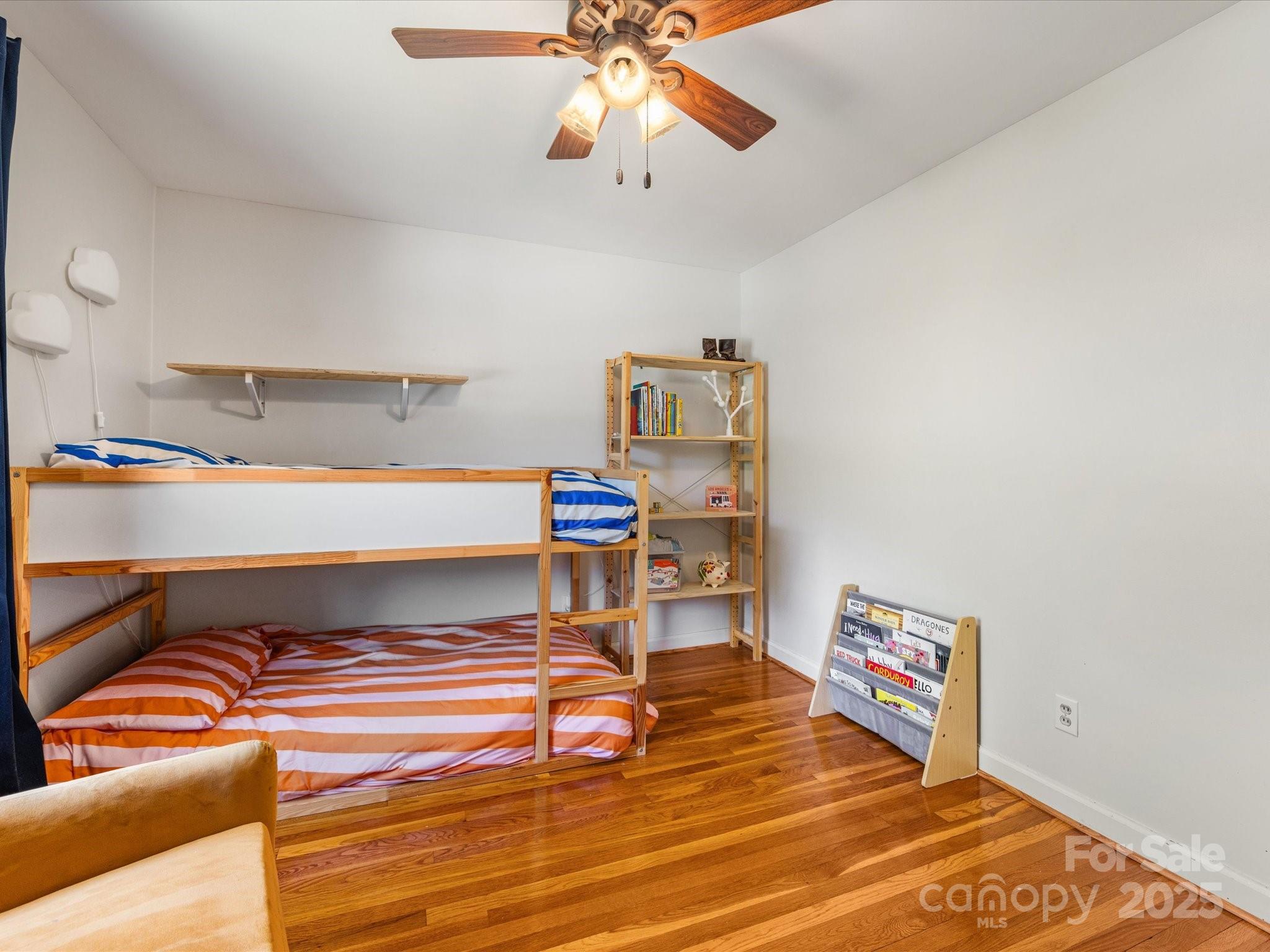 3200 Spring Valley Road Charlotte, NC 28210 - Photo 28 of 45 a hallway with a bed and a chandelier