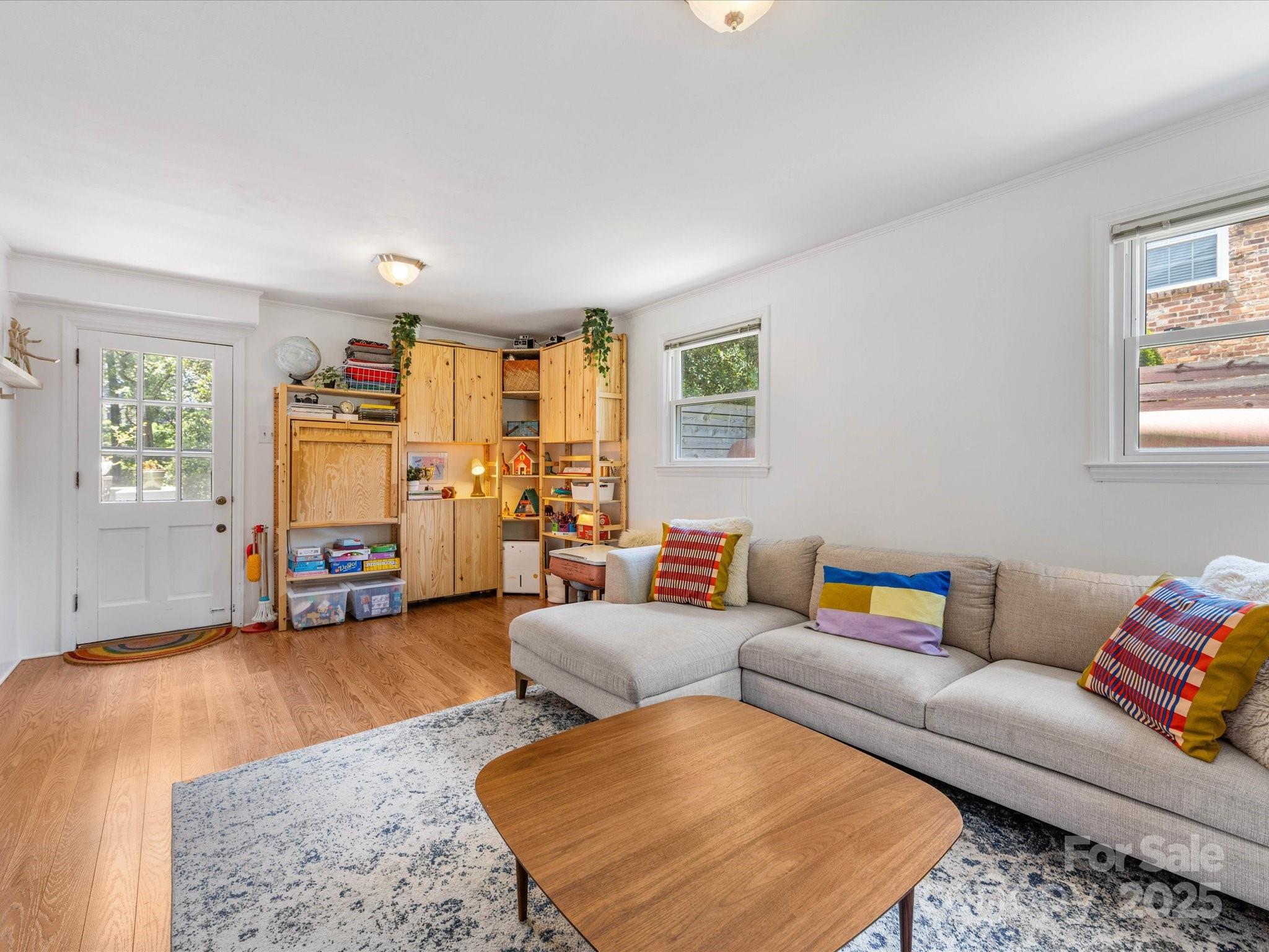 3200 Spring Valley Road Charlotte, NC 28210 - Photo 30 of 45 a living room with furniture and a flat screen tv