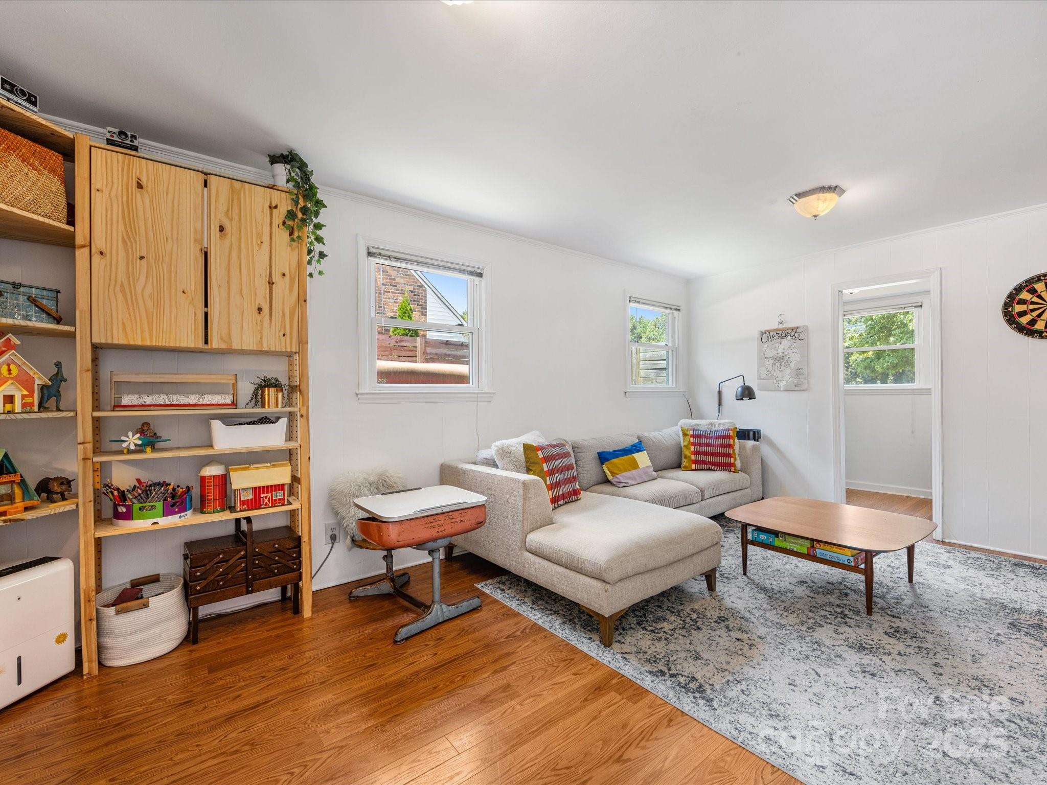 3200 Spring Valley Road Charlotte, NC 28210 - Photo 31 of 45 a living room with furniture and a wooden floor