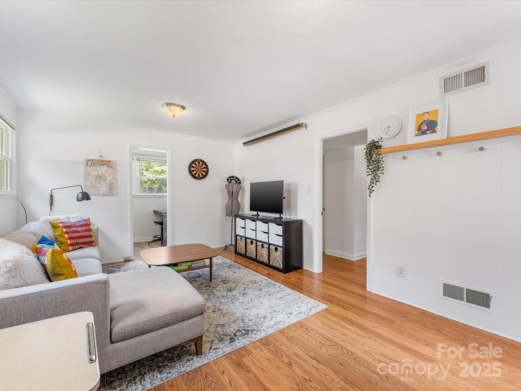 3200 Spring Valley Road Charlotte, NC 28210 - Photo 32 of 45 a living room with furniture and a wooden floor