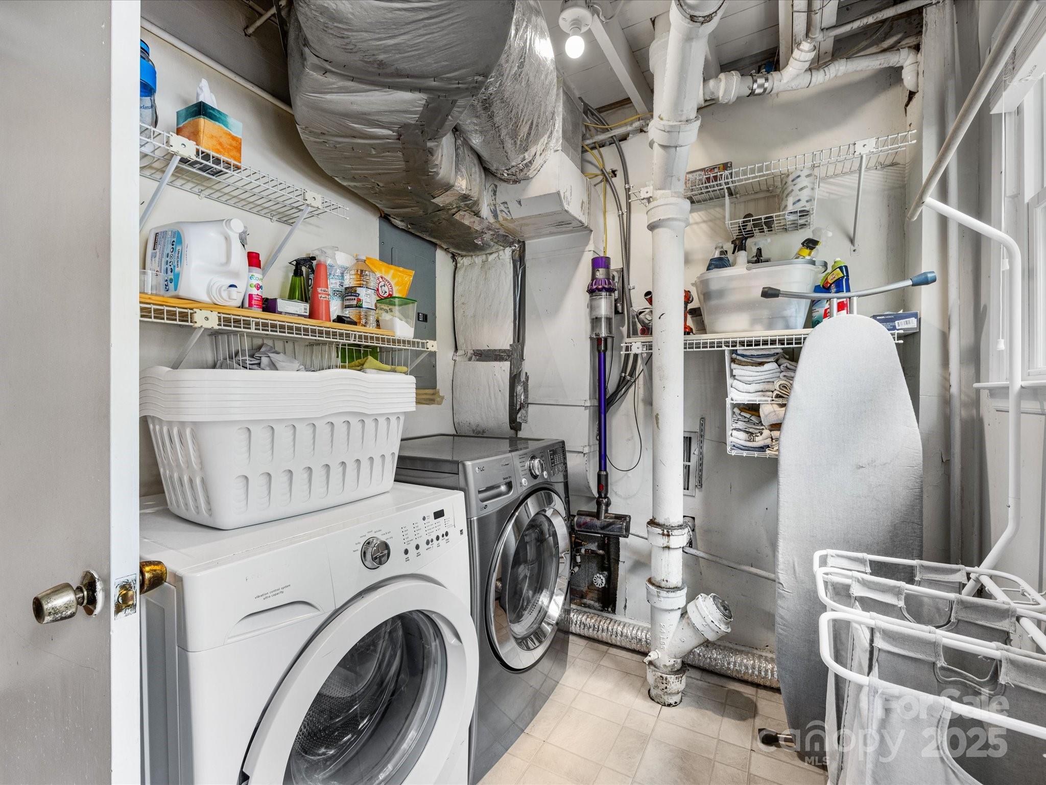 3200 Spring Valley Road Charlotte, NC 28210 - Photo 35 of 45 a view of storage and utility room with washer and dryer