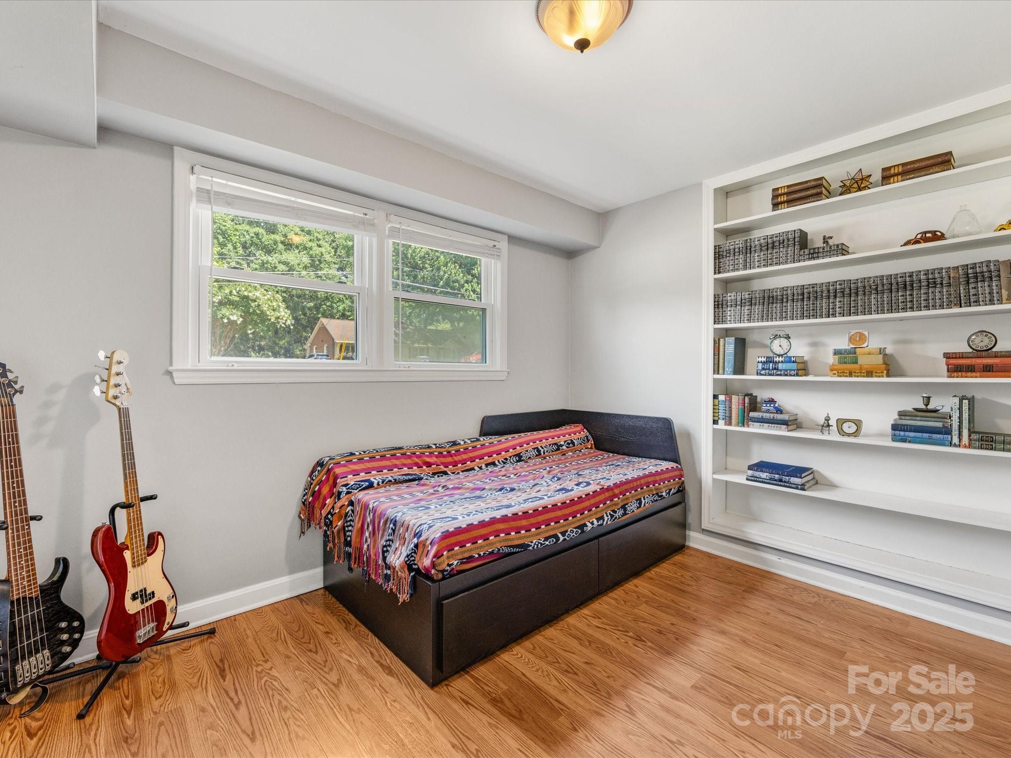 3200 Spring Valley Road Charlotte, NC 28210 - Photo 36 of 45 a bedroom with a bed and a window