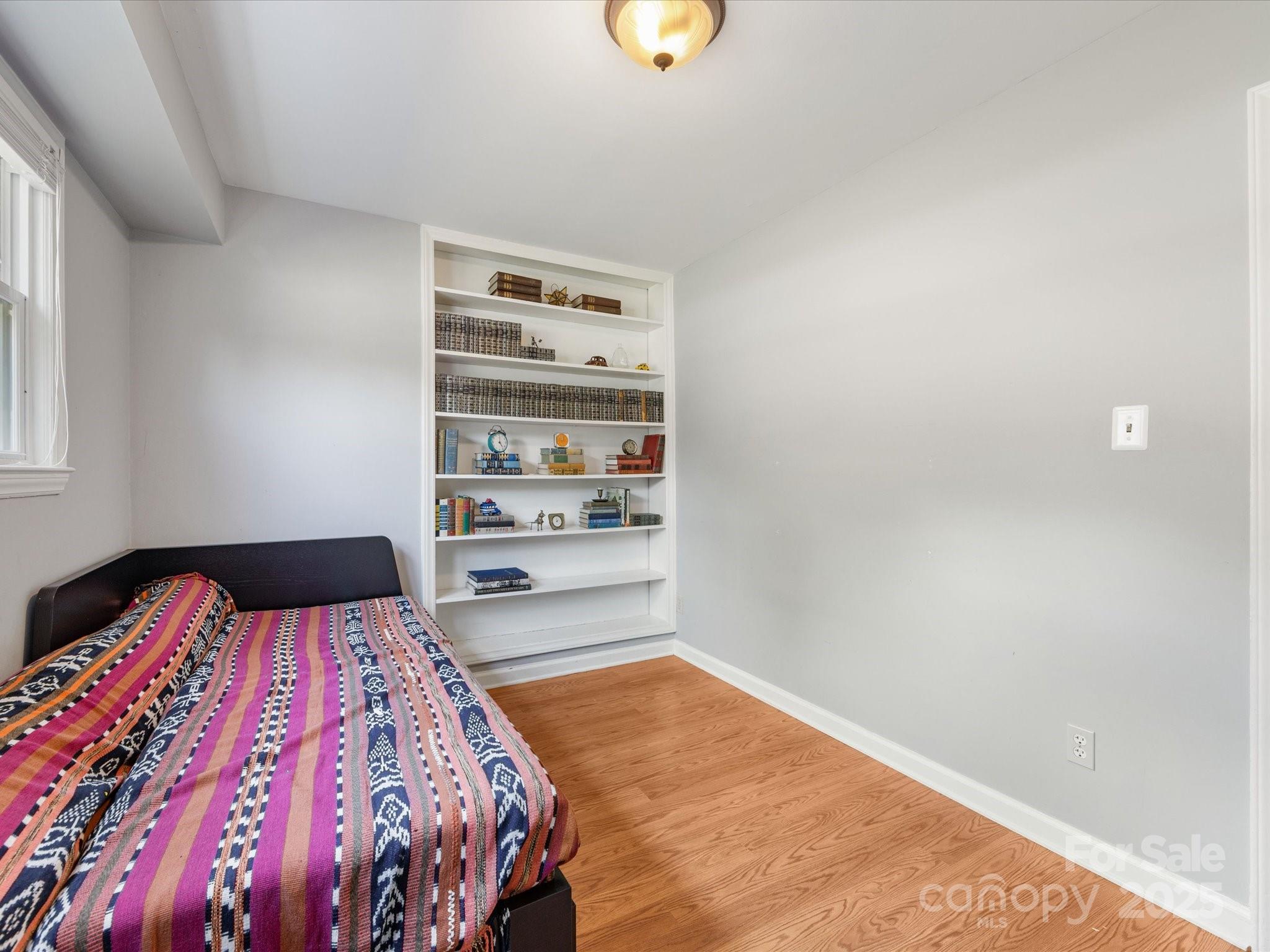 3200 Spring Valley Road Charlotte, NC 28210 - Photo 37 of 45 a bedroom with a bed and a window