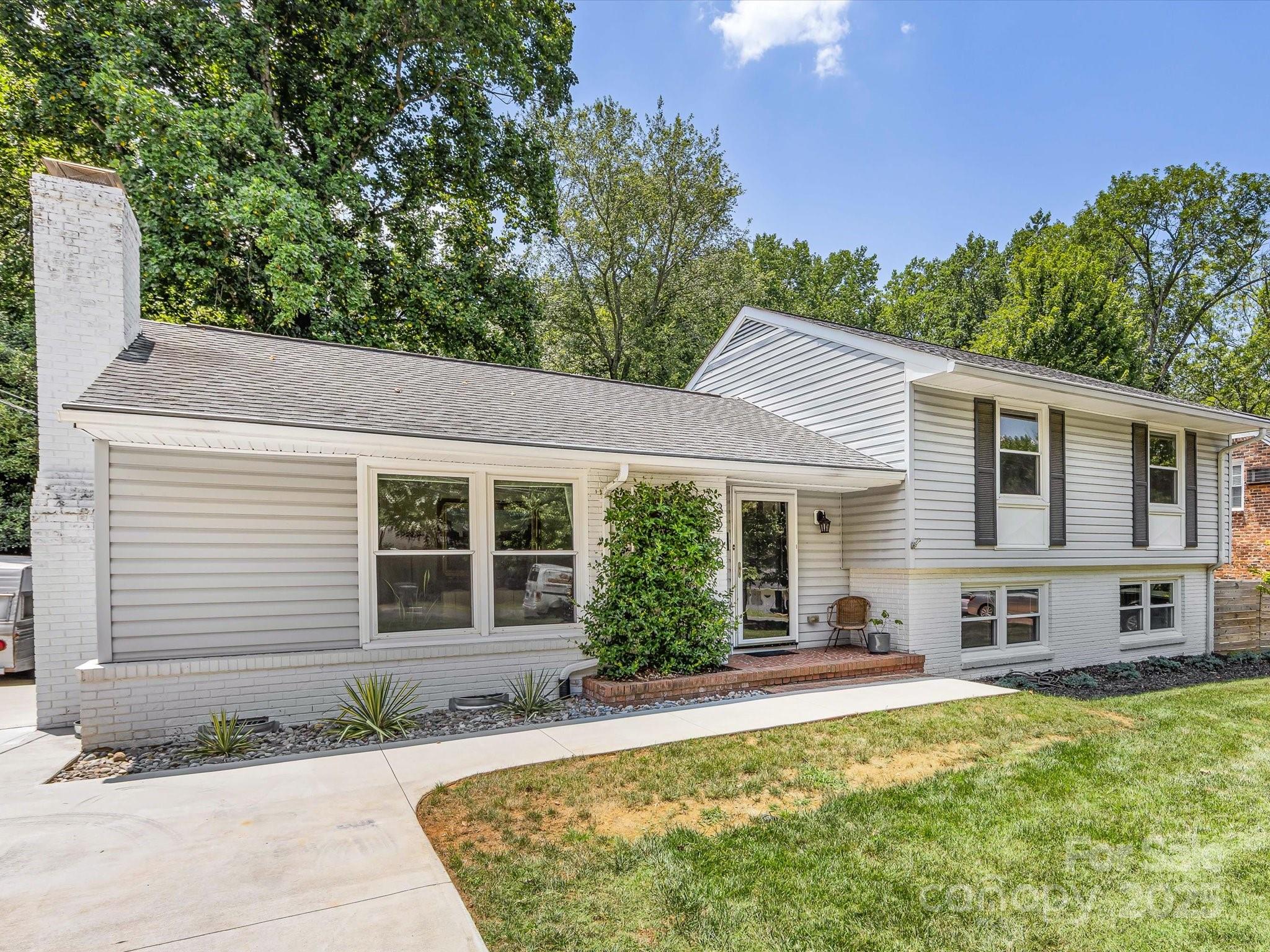 3200 Spring Valley Road Charlotte, NC 28210 - Photo 4 of 45 a view of a house with a patio
