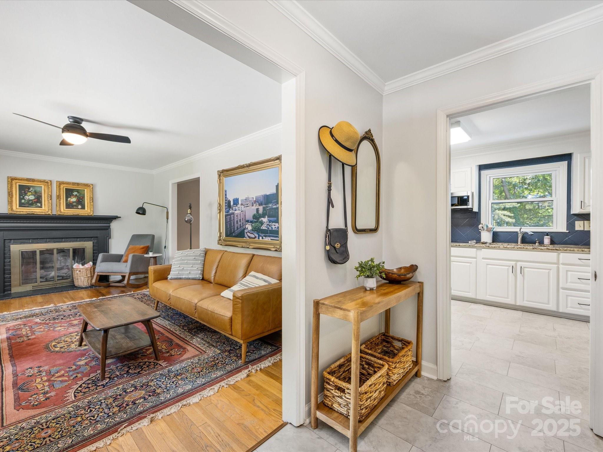 3200 Spring Valley Road Charlotte, NC 28210 - Photo 6 of 45 a living room with furniture and a fireplace