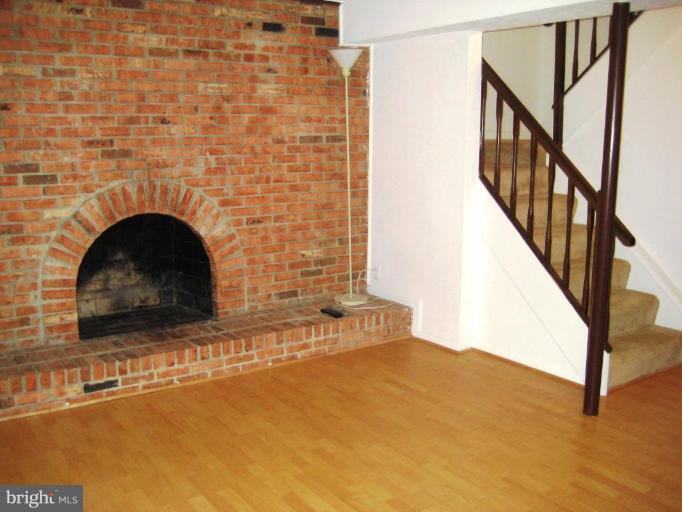 167 Annandale Road Falls Church, VA 22046 - Photo 18 of 21 Brick wood burning fireplace with hearth
