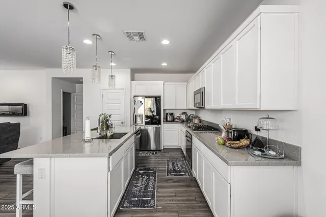 a bedroom with a bed and a desk