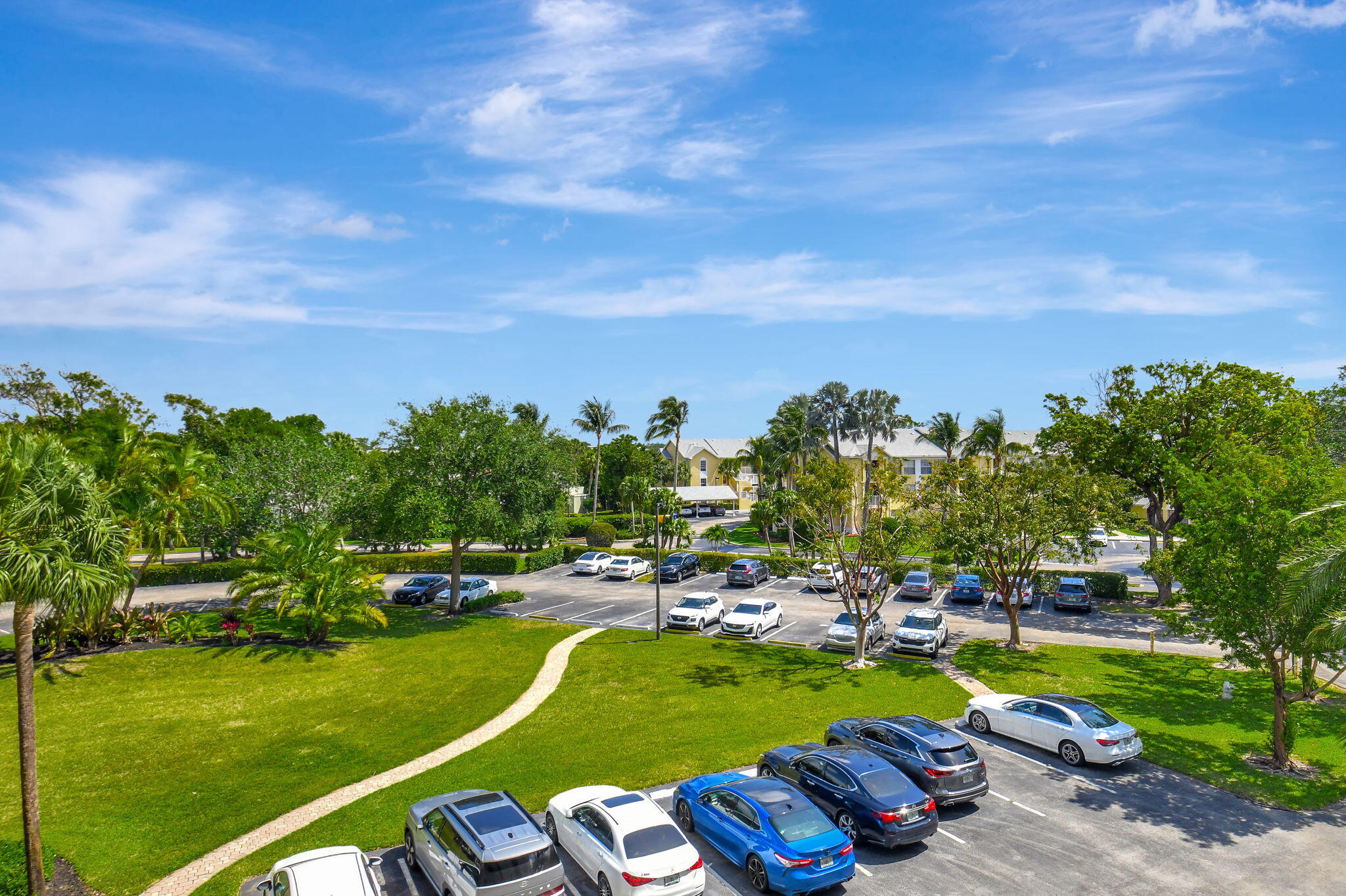 6372 La Costa Drive, Unit 302 Boca Raton, FL 33433 - Photo 11 of 52 a view of a swimming pool and deck in the backyard