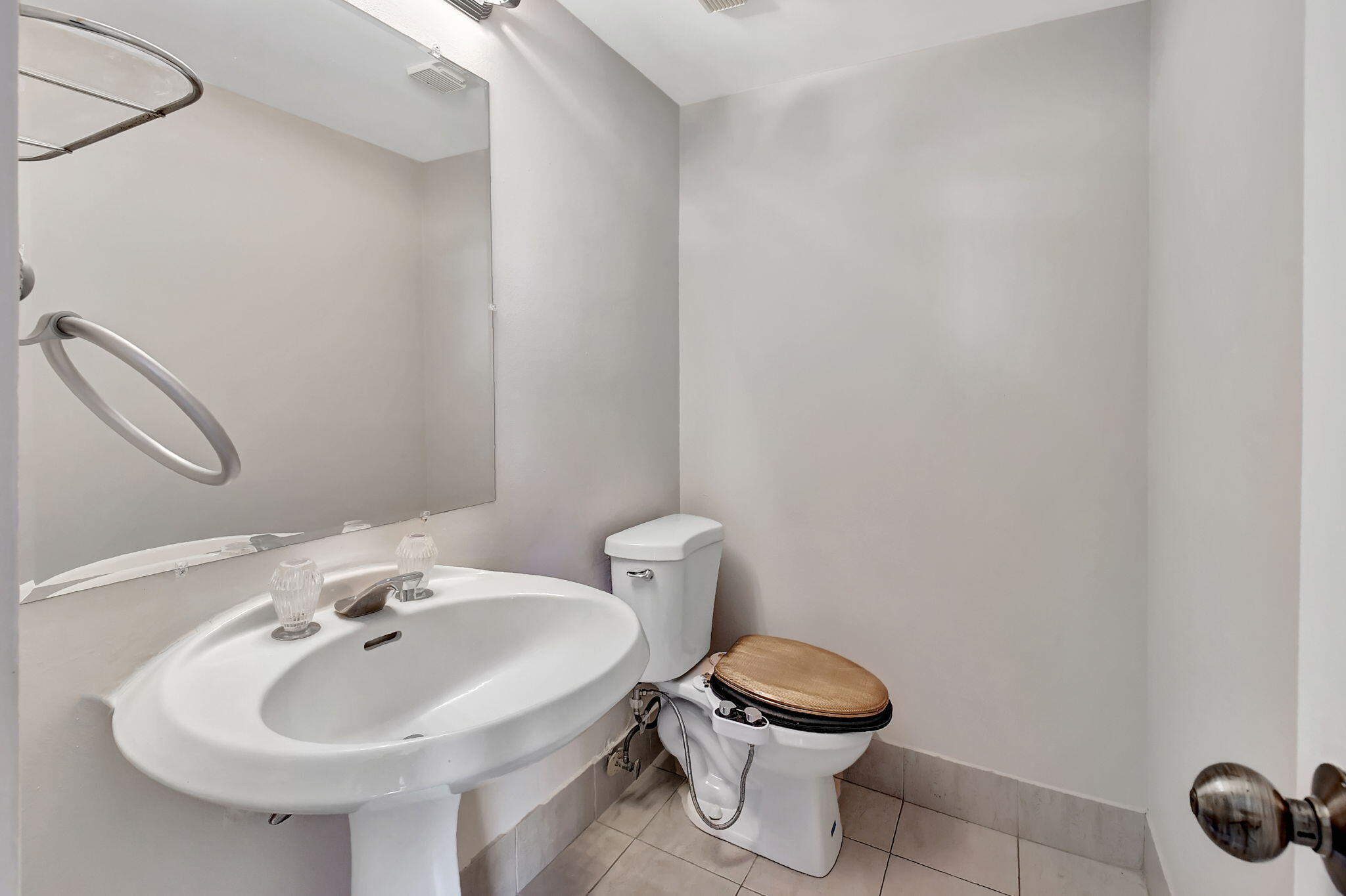 6372 La Costa Drive, Unit 302 Boca Raton, FL 33433 - Photo 12 of 52 a bathroom with a toilet sink and mirror