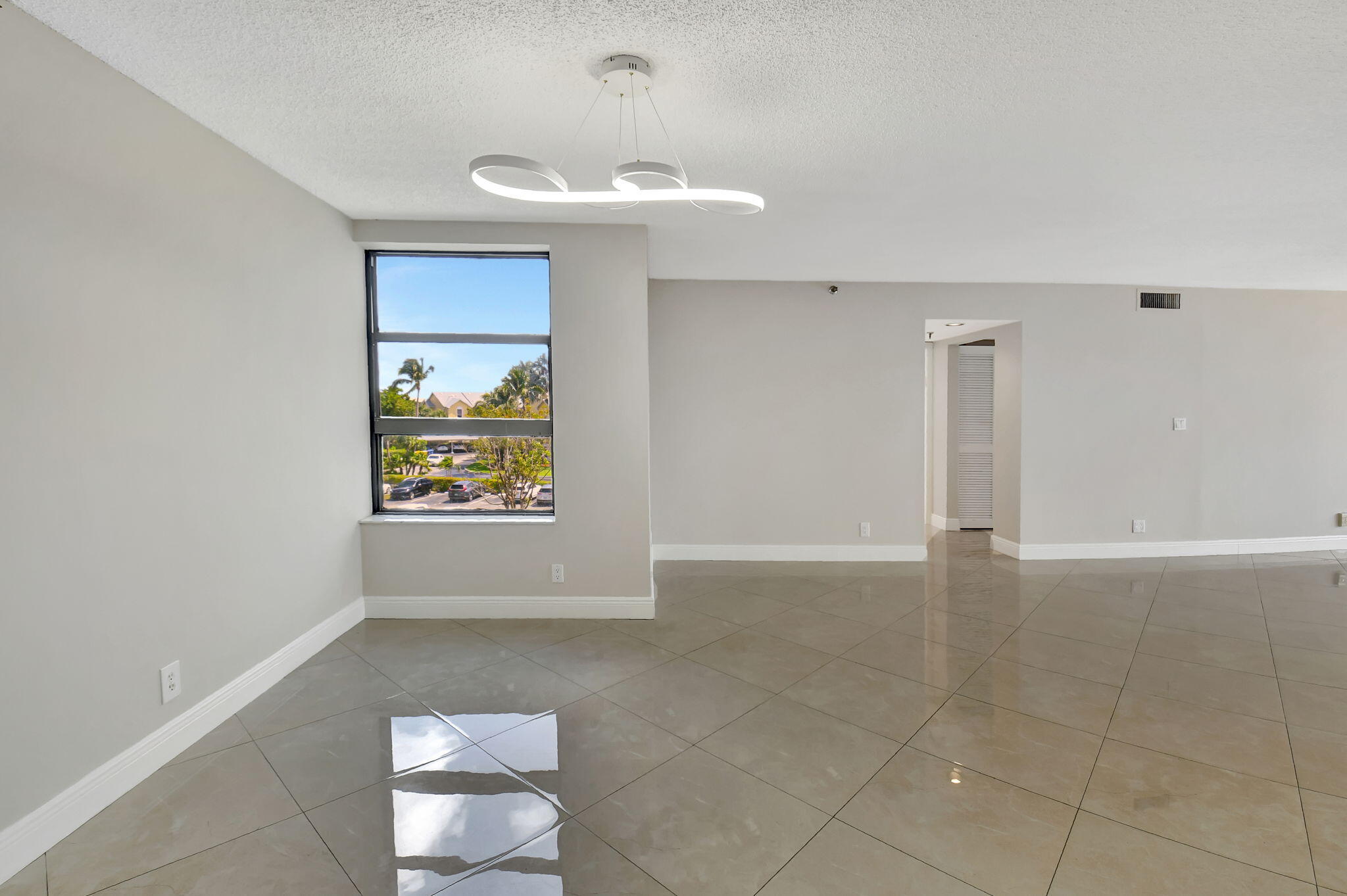 6372 La Costa Drive, Unit 302 Boca Raton, FL 33433 - Photo 17 of 52 a view of an empty room with a window