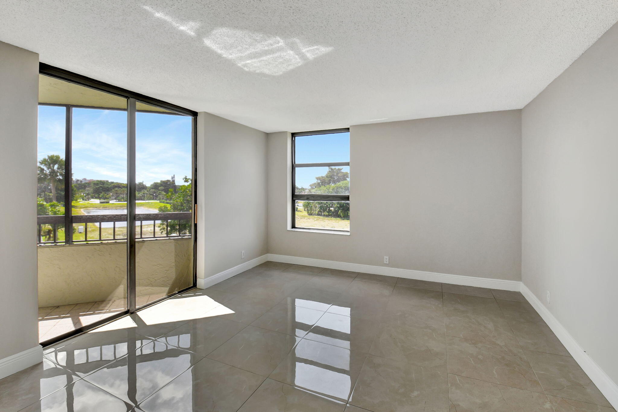 6372 La Costa Drive, Unit 302 Boca Raton, FL 33433 - Photo 31 of 52 a view of an empty room with a window